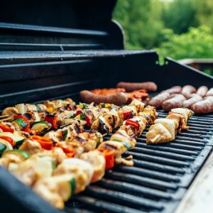 a Torbitts BBQ grilling chicken and vegetables